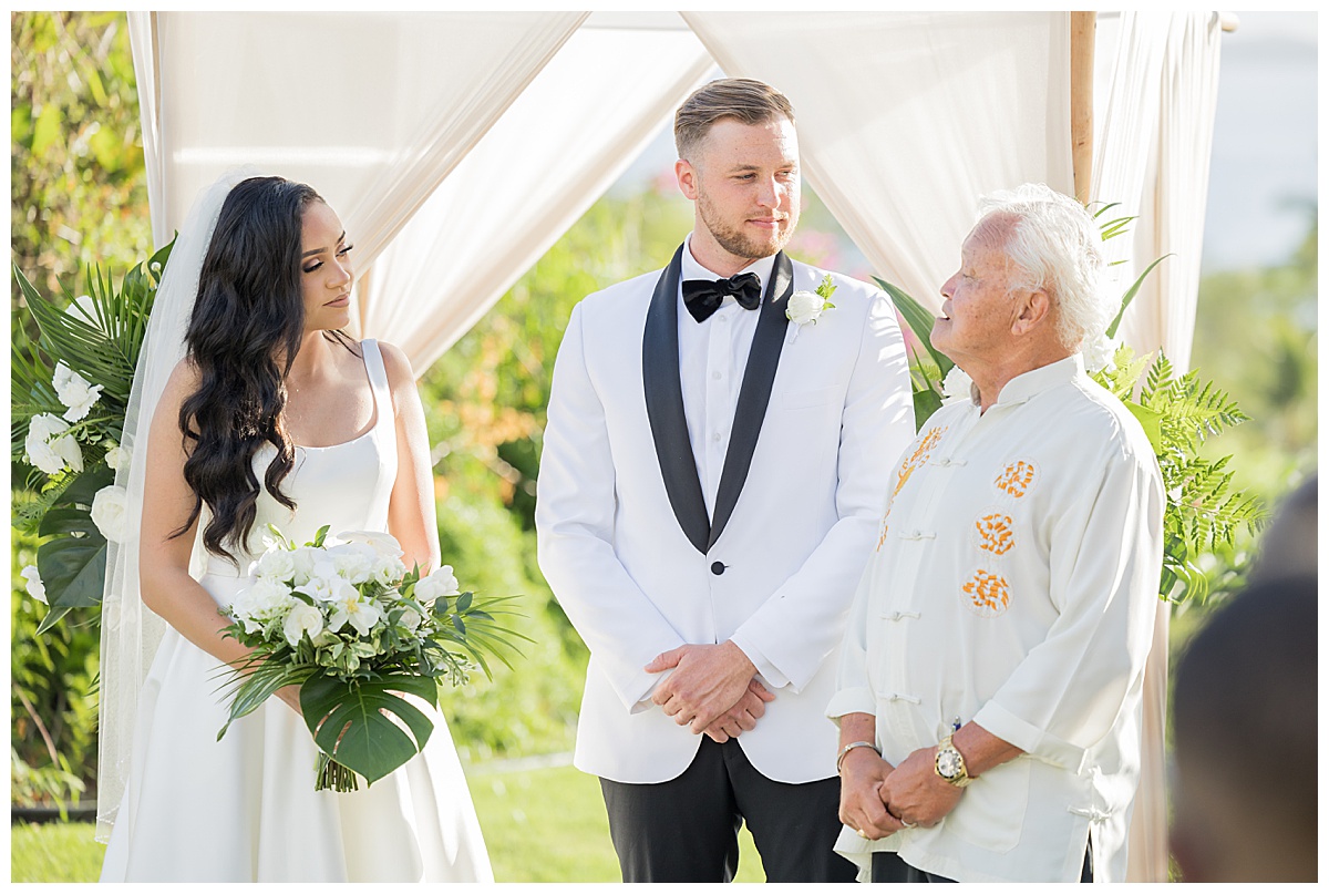 A couple gets married during their Hawaii wedding