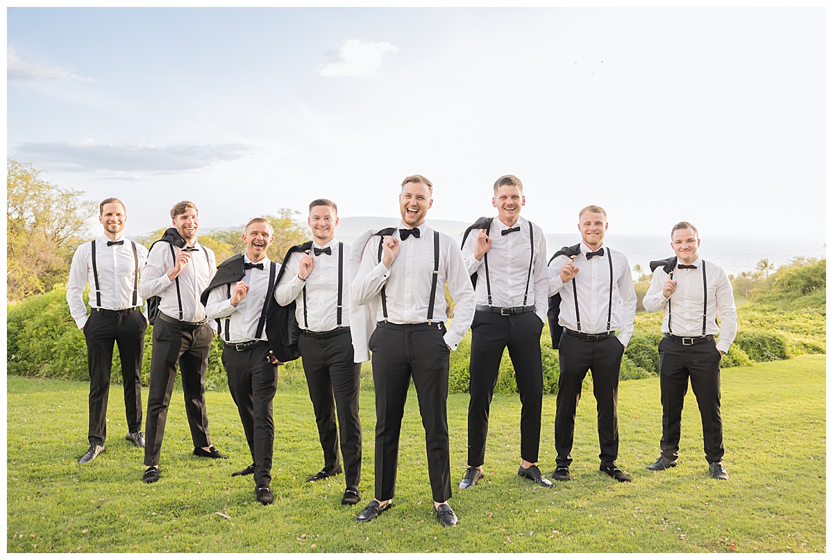A groom poses with his friends at his Hawaii wedding