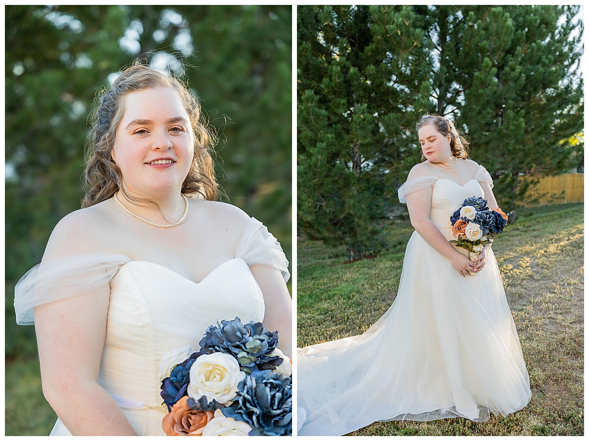 The bride poses in front of trees for her bridal portraits
