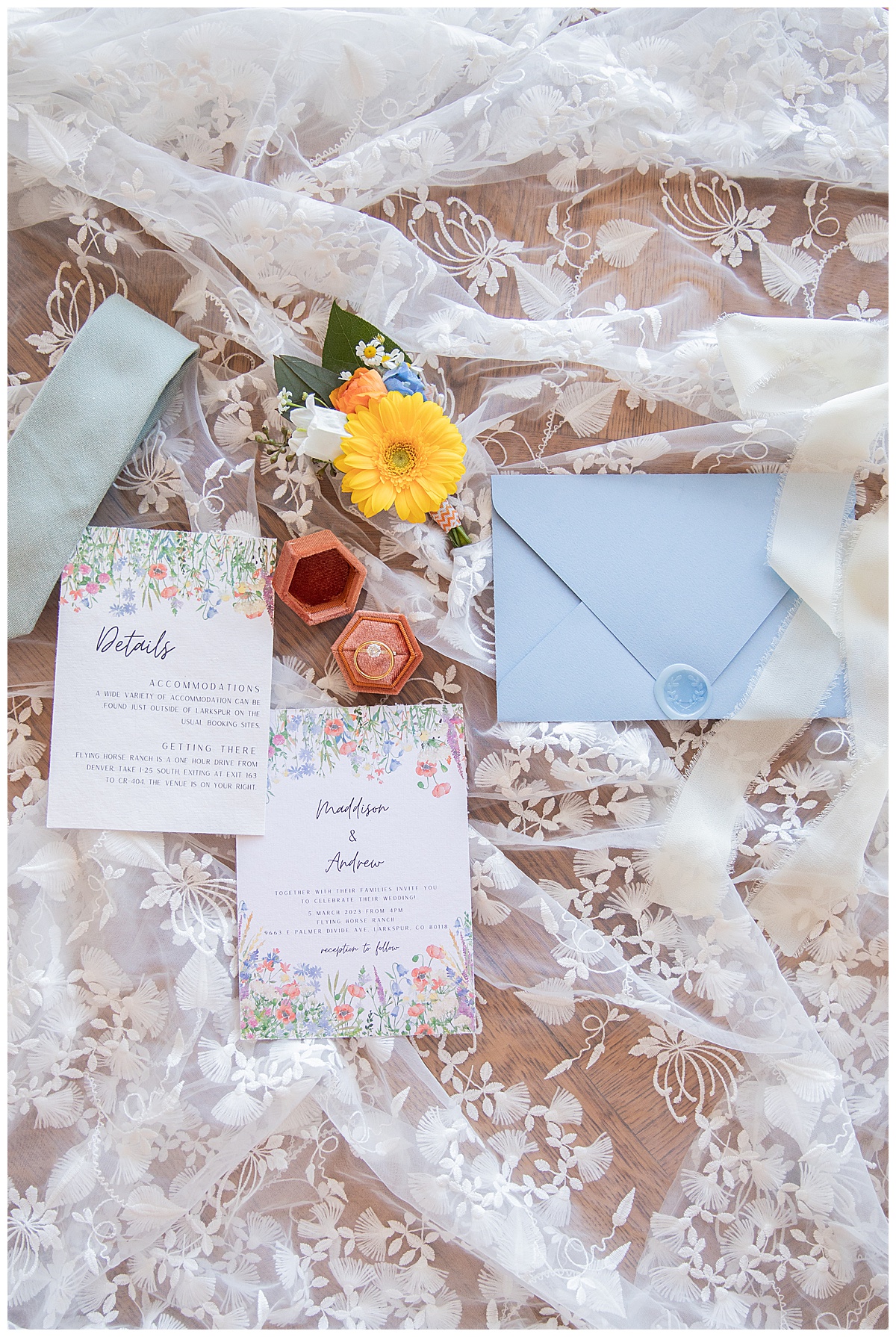 An invitation suite with wildflowers, blue, and yellow colors perfectly compliments this spring wedding inspiration shoot.