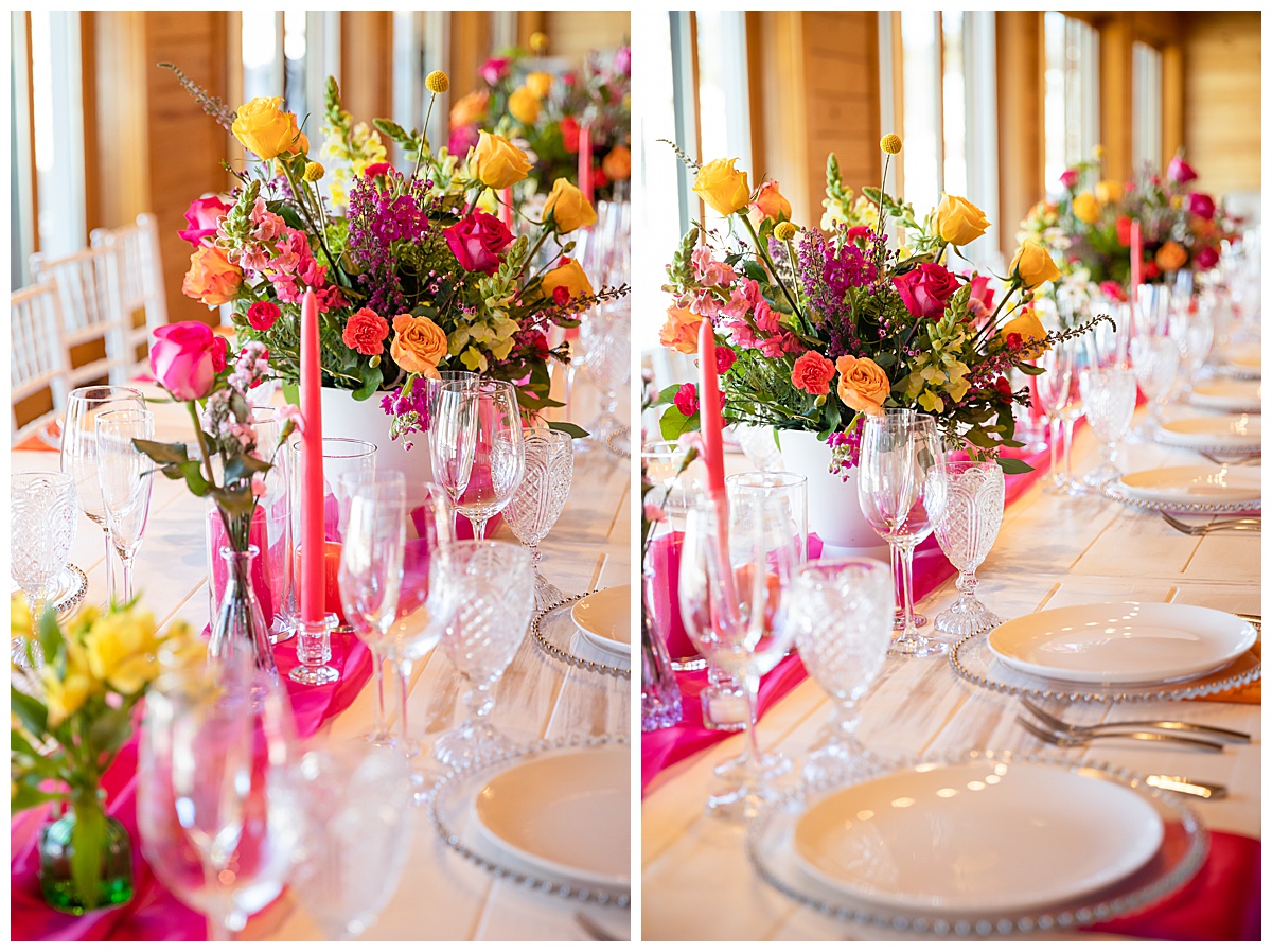 This table scape is filled with bright-colored flowers, glass cups and dishes, pink candlesticks, and a bright pink runner. Perfect for this summer wedding inspiration photo shoot!