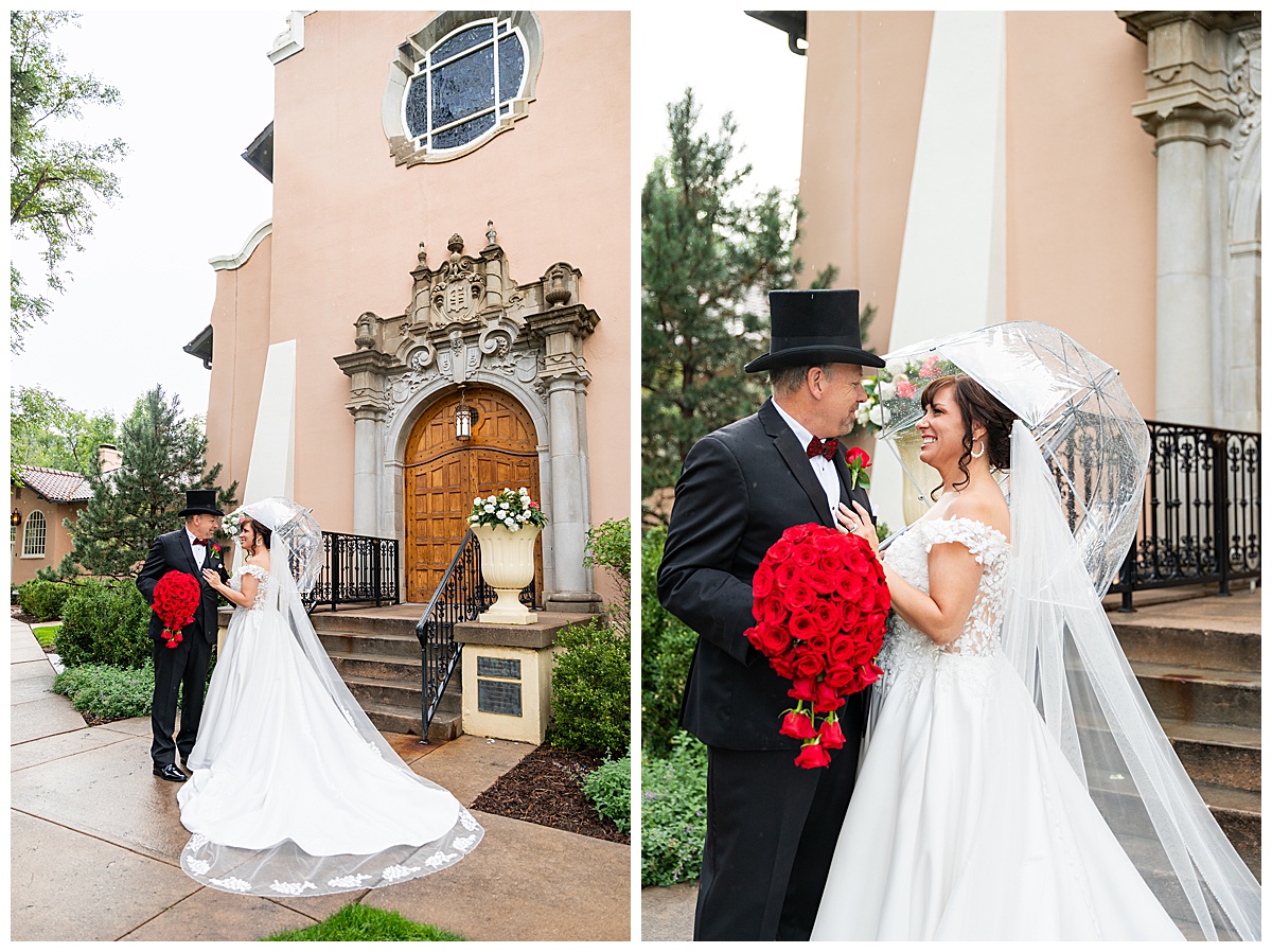 Couples portraits of a bride and groom during their Broadmoor wedding. The groom is wearing a black suit and black top hat. The bride is wearing a lace ballgown and a long veil. They are posing with a clear umbrella.