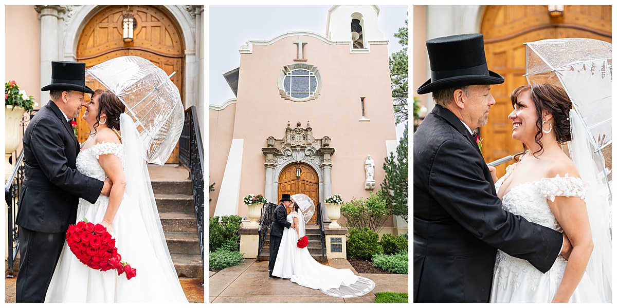 Couples portraits of a bride and groom. The groom is wearing a black suit and black top hat. The bride is wearing a lace ballgown and a long veil. They are posing with a clear umbrella.