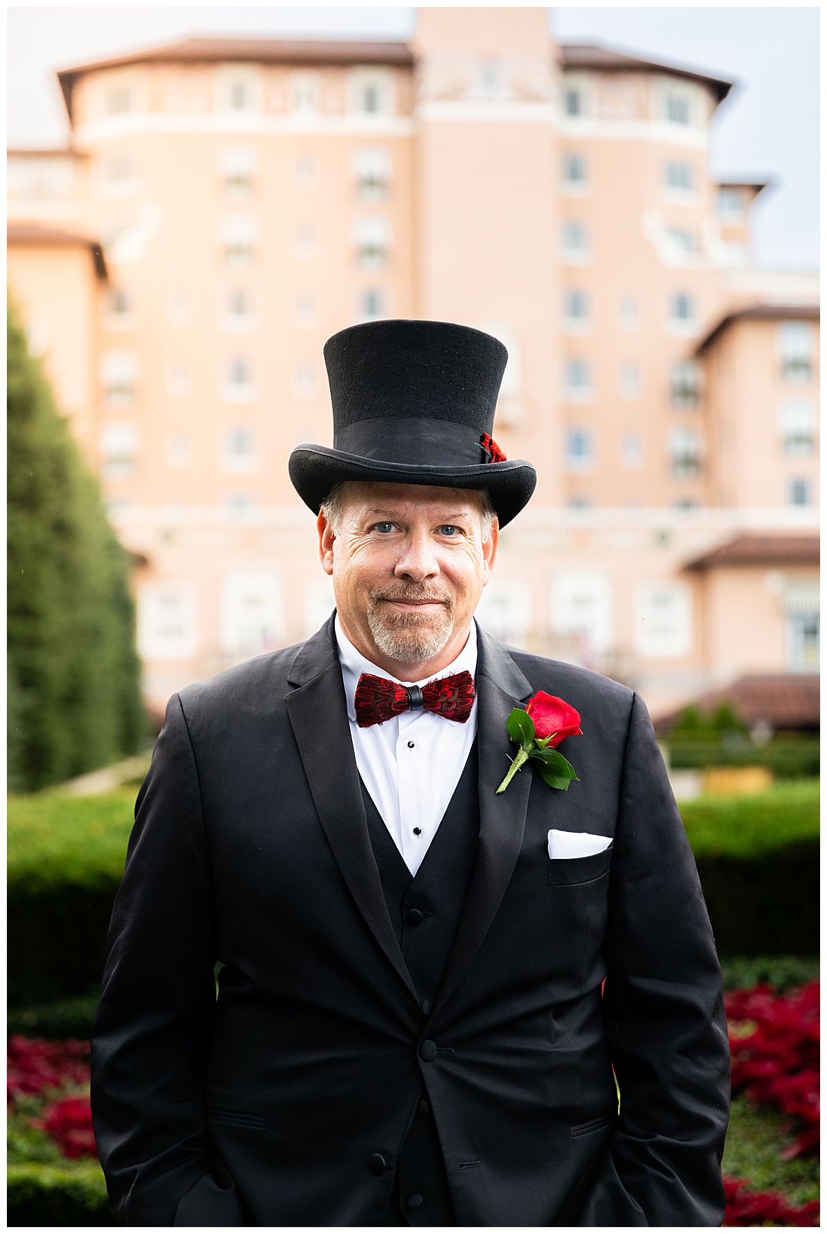 Portraits of a groom during his Broadmoor wedding. The groom is wearing a black suit and black top hat.