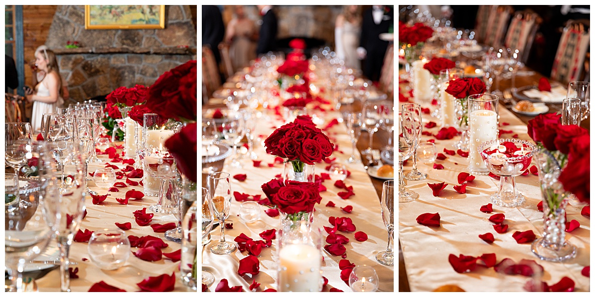 The long table inside the lake house is decorated with a champagne table cloth and runner, rose bouquets, rose petals, and candles in glass vases.