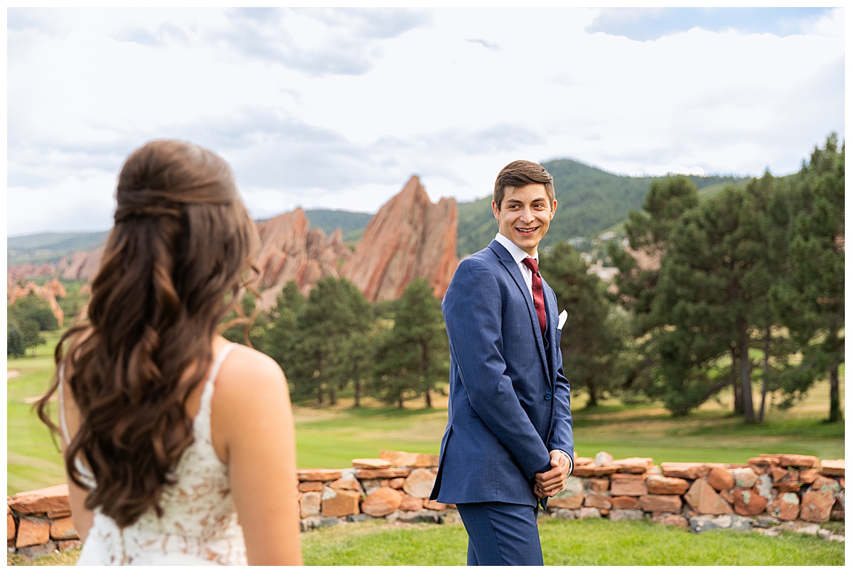 The bride and groom do their first look. 