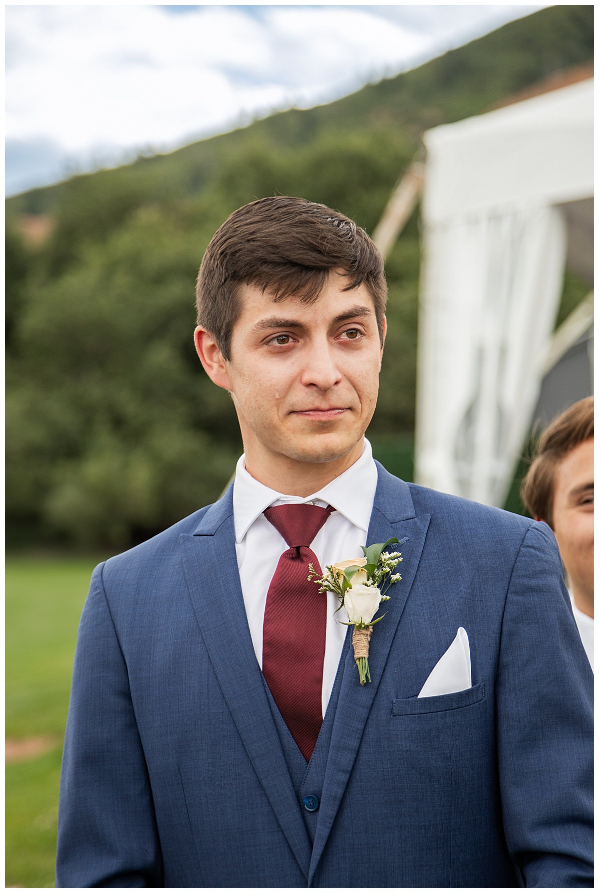 The groom is excited and tears up watching his bride walk down the aisle.