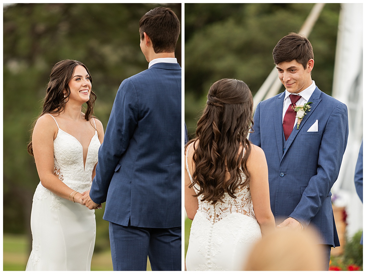 The couple hold hands during their wedding ceremony. Their bridal party is standing next to them and their guests are seated. The red rocks and golf course are in the background.