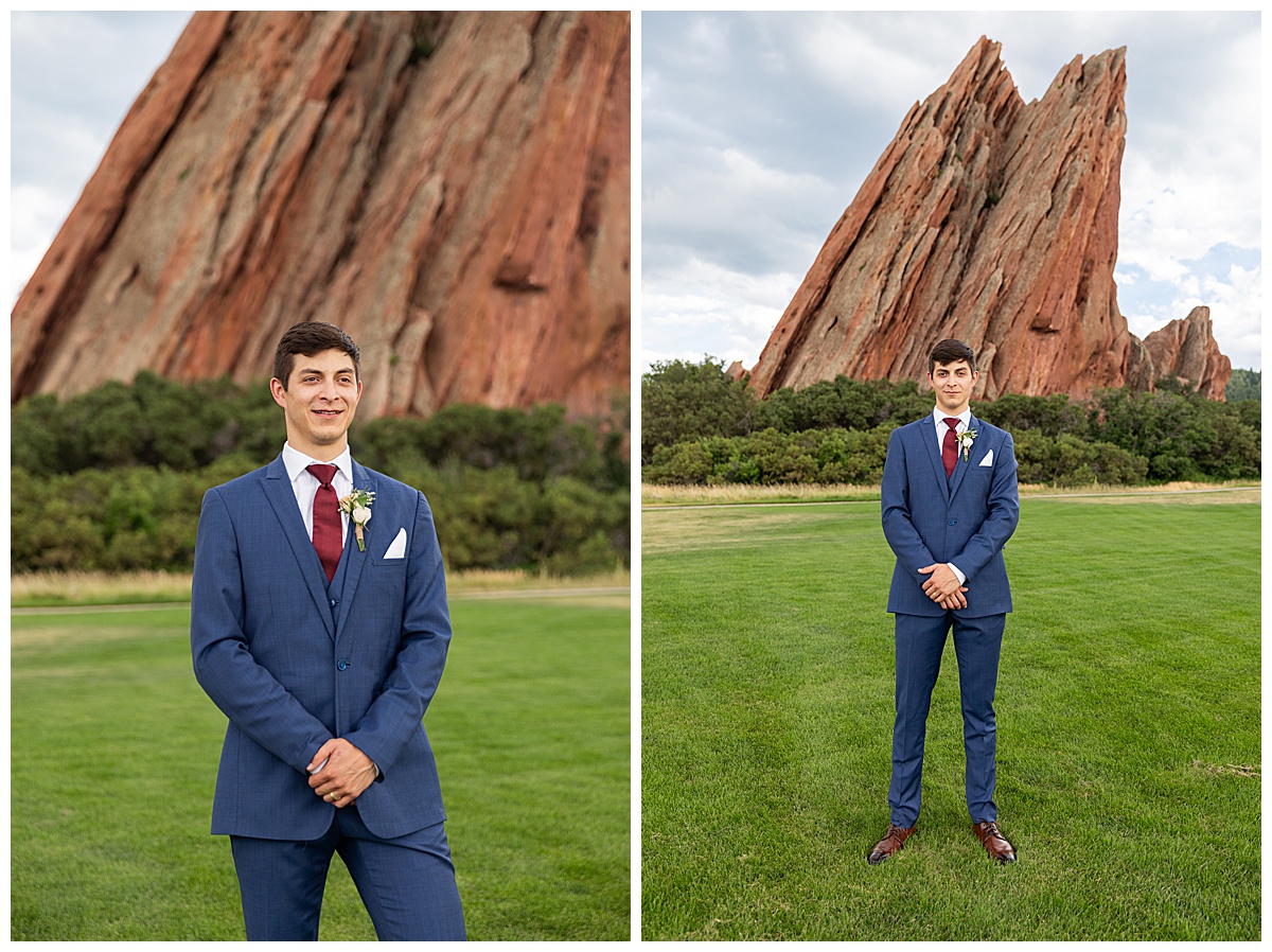 The couple pose on the golf course for bridal portraits. She is holding her bouquet. There are big red rocks in the background.