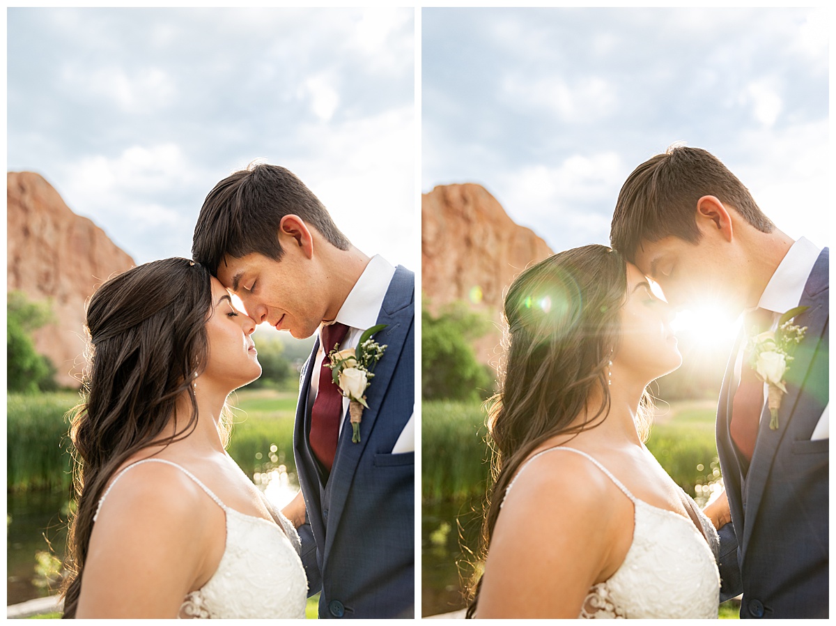 The couple pose on the golf course for bridal portraits. She is holding her bouquet. There are big red rocks in the background.