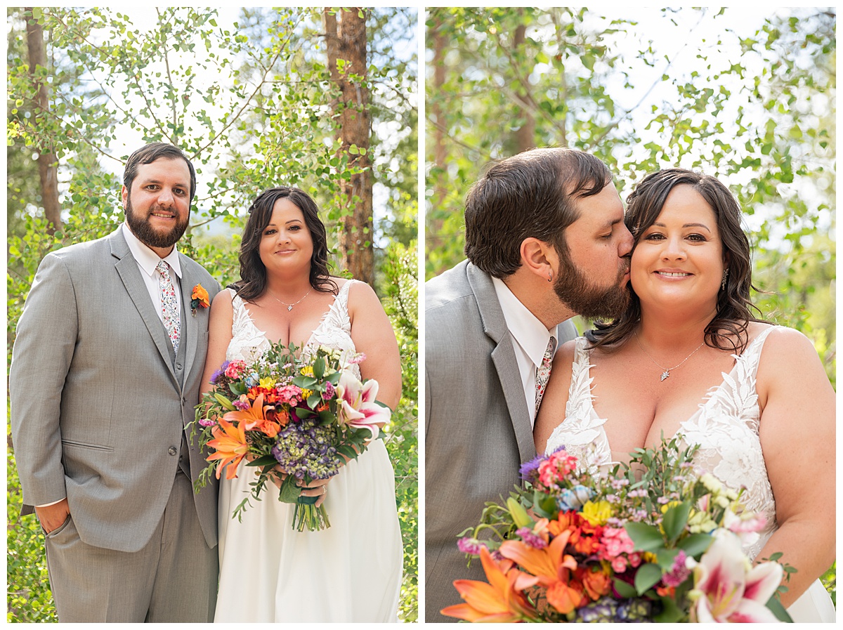 The bride and groom pose for photos. Pine trees are behind them.