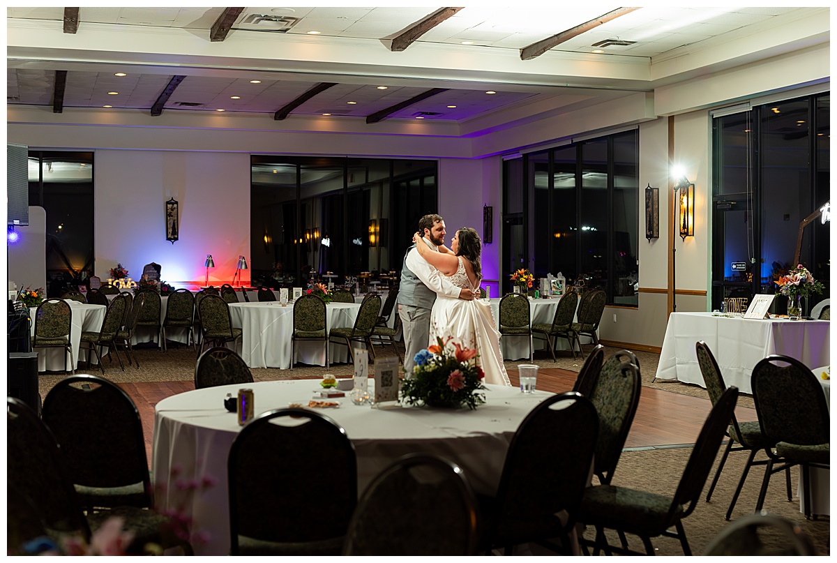 The couple shares their last dance in the ballroom of the Winter Park Mountain Lodge. There is no one else in the room and they have a private moment.