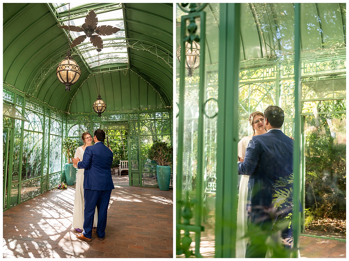 The bride and groom dance inside the green metal Woodland Mosaic Solarium. The solarium is empty now.