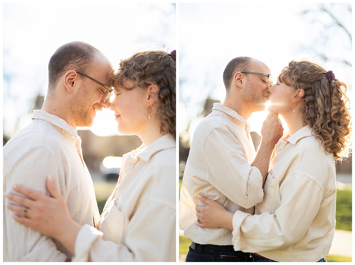 Lily & Cody pose in Bega Park. Lily has curly brown hair and is wearing a red shirt, a cream jacket, and jeans. Cody is wearing glasses with a cream button down shirt and jeans.