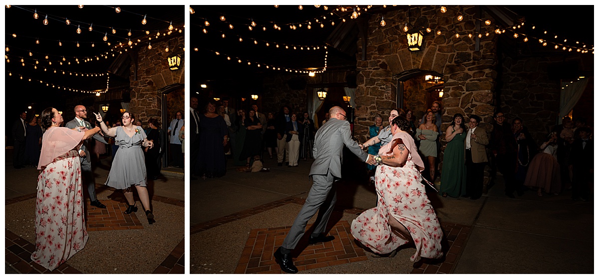 The groom dances with his mom and sibling in the dark outside the Boettcher Mansion under fairy lights.